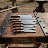 7-Piece Damascus Steel Kitchen Knife Collection with Flowing Water Pattern Blades.